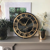 alt="black resin wall clock with golden frame luxury handmade designer wall clock for modern home decor"